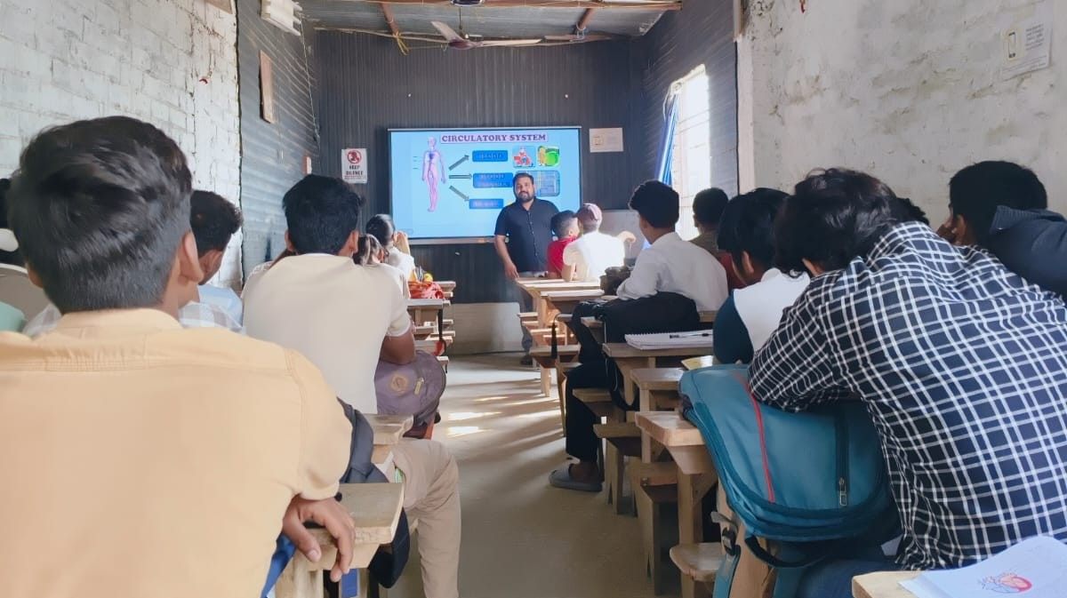 Attentive students taking notes in full classroom session at Pragyan Institute Lalganj